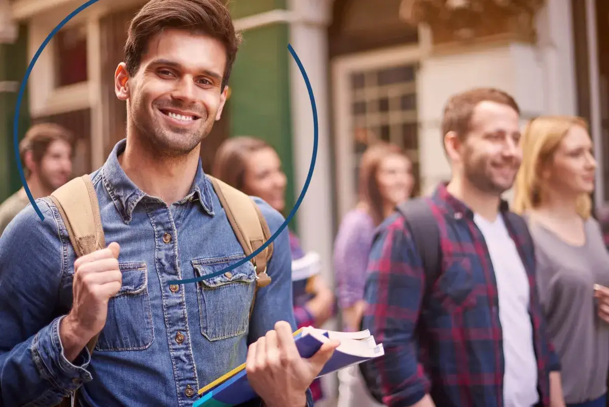 Man with book smiles
